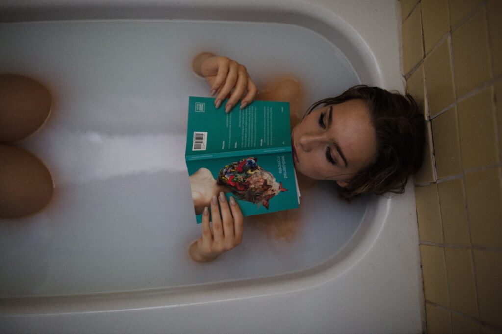 how to treat candida with neem - woman-in-tub-with-book